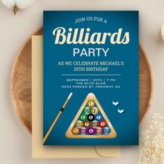 a birthday party card with billiards and pool balls on it next to a wooden plate