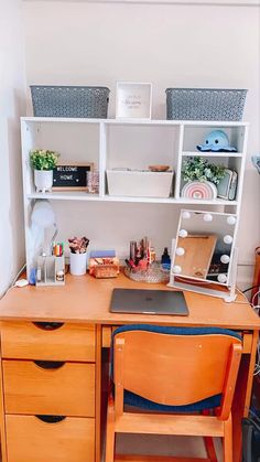 a wooden desk with two drawers and a laptop on it