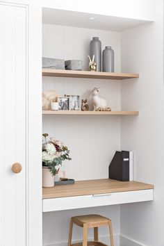 the shelves in this room are filled with vases and other items, including flowers