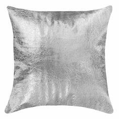 a silver pillow on a white background