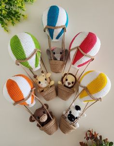 small knitted hot air balloons with animals in them