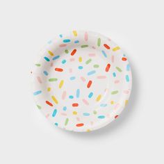 a paper plate with sprinkles on it