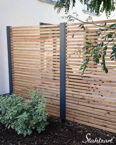 a wooden fence with different sections labeled in red, white and blue lines on it