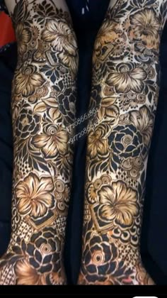 the legs and arms are decorated with gold flowers on black fabric, as well as an intricate