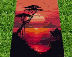 an image of a beach towel that is made out of pixellated images and trees