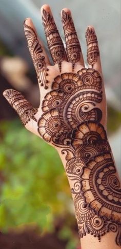 a hand with henna on it