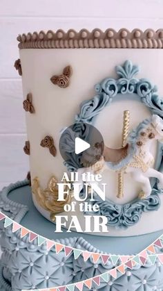 a white and blue cake with an image of a horse on it's side