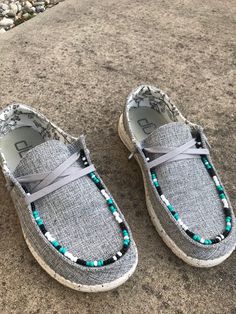 Gray Hey Dude shoes with turquoise, white and black beads around the top of the shoe. Aesthetic Hey Dudes, Western Air Force Ones, How To Make Beaded Hey Dudes, Beaded Hey Dudes Diy, How To Bead Hey Dudes Tutorial, Custom Hey Dude Shoes Women, Diy Hey Dudes, Hey Dudes Aesthetic, Country Hey Dudes