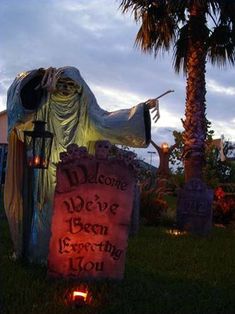 a grave with a ghost holding a lit candle