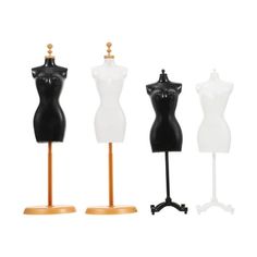 three mannequins are standing on wooden bases, each with a different shape