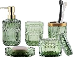 green glass bathroom accessories including toothbrush holder and soap dispenser