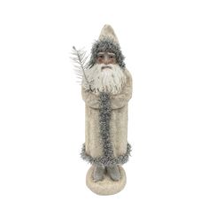 a statue of santa claus holding a plant in his hand and wearing a hat with silver tinsel on it