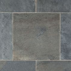 a close up view of a slate tile floor