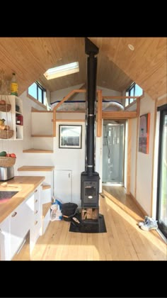 the interior of a tiny home with wood floors