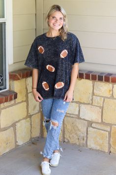 Short sleeve washed sparkly football graphic.McKenna is wearing a size Medium Full length teelight weightblack washed colorRuns true to sizeHEY BABE! WE ONLY OFFER STORE CREDIT FOR RETURNS! Feel free to email us or DM us on Instagram with any questions regarding fit or sizing or our return policy in general. Sequin Football Shirt, Black Washed T-shirt For Fall, Sporty Black Washed T-shirt, Sporty Graphic Print Top For Tailgating, Sporty Short Sleeve Tops For Tailgating, Black T-shirt For Game Day In Fall, Black T-shirt For Fall Game Day, Sporty Crew Neck Top For Tailgating, Sporty Black Washed Top