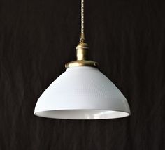 Pendant Light with Large Waffle Print Milk Glass Shade. Hand-finished in raw brass, champagne brass, antique brass, oil rubbed bronze, satin nickel. Made to order for hard-wire installation or with a wall plug. Mix and match different finishes, cord colors, lengths.  Custom orders are welcome! * White milk glass shade: 10" wide x 5.5" tall * Matching ceiling canopy is included * Available with or without turn knob * UL listed socket (E224663), 250W / 250V * Medium base for incandescent, LED, or CFL bulb * On/Off turn knob (simply leave it on and use your wall switch) * Works with a wall dimmer * Max Wattage: 75 watts * Wire Gauge: 18 * Standard cord length: 36", custom lengths available * Hardware kit and installation instructions are included * Matching semi flush light available (please Cottage Kitchen Lighting, Kitchen Lighting Farmhouse, Lighting Farmhouse Style, Brass Ceiling Lamp, Wire Installation, Wire Gauge, Flush Light, Semi Flush Lighting, Cfl Bulbs