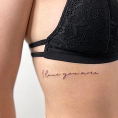 a woman's stomach with the words i love you more written on her side