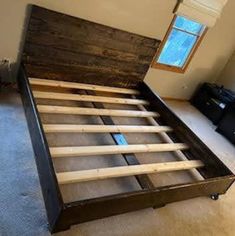 the bed frame is made out of wood and has no headboard or foot board