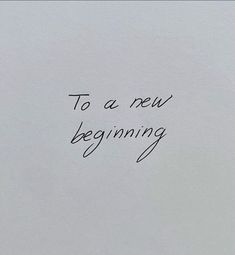 a piece of paper with the words to a new beginning written in black ink on it