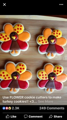 four decorated cookies in the shape of turkeys