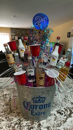 a bucket filled with liquor bottles and condiments