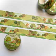 two rolls of washi tape sitting next to each other on top of a table