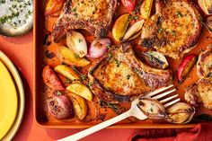 a pan filled with meat and vegetables on top of a red table cloth next to a yellow plate