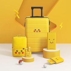 a yellow suitcase with pikachu emoticions on it and other items around it