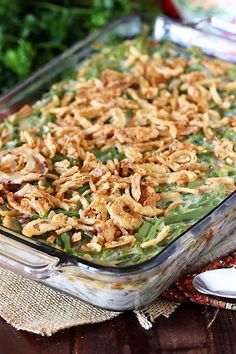 a casserole dish filled with green beans and toppings