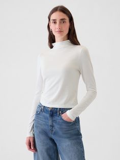 Soft, stretch cotton-modal blend turtleneck top.  Turtleneck.  Long sleeves.  Fit: Stretch-to-Fit.  Slim & stretchy that forms to your shape.  Hits at the hip.  Models wearing Gap Knit Turtleneck, Turtleneck Top, Gap Women, Turtle Neck Top, White Long Sleeve, Turtleneck Sweater, Stretch Cotton, Sweater Outfits, Gap