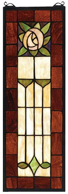 a stained glass window with the letter e on it's front and side panels