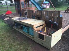 an outdoor play area made out of wooden pallets