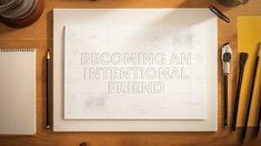 a desk with writing on it and various office supplies surrounding the paper that says becoming an international friend