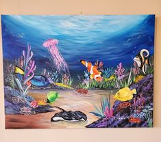 an underwater scene with fish, jellyfish and other marine life painted on the wall