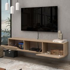 a living room with a large flat screen tv mounted on the side of it's wall