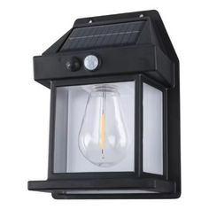 an outdoor wall light with a solar panel on the top and one light bulb at the bottom