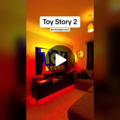 the toy story 2 logo is displayed in front of a television screen with red lights