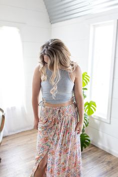 Look no further, our best-selling maxi skirt is here in a fresh new print! The stunning bright floral print, flattering button detail, and a flowy maxi-length is sure to make this your go-to for any summer get-together! Whether you’re heading out on a flirty date night or a daytime gathering, the only thing you’ll be worried about is having too much fun! Features: smocked elastic waist, functional buttons, lined to knee, floral print, open in front, long length Color: Blush Mix100% RayonFor full care instructions, please refer to the manufacturer's label. Fit: True to size.Length: Hits at the ankle on most -- 42” in total lengthWaist: Stretchy with elastic waistbandHips: Relaxed with give Models are wearing size Medium and Small respectively. MODEL INFO Ashley Brook Height: 5'3" Height: 5' Floral Maxi Skirt, Floral Maxi, Long Length, New Print, Smocking, Elastic Waist, Date Night, Maxi Skirt, Floral Prints