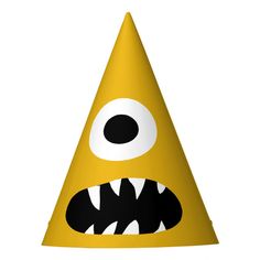 a yellow party hat with monster eyes on it