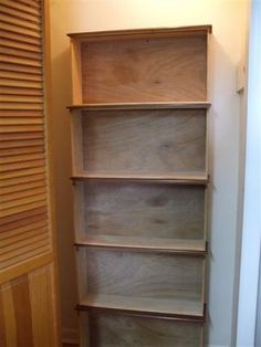 an empty book shelf in the corner of a room