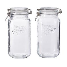 two glass jars with metal lids are shown side by side, one is empty and the other has no lid