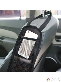 the cell phone holder is attached to the car's front passenger side seat pocket