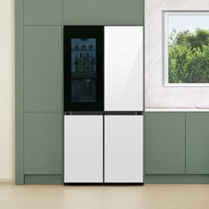 a white refrigerator freezer sitting inside of a kitchen