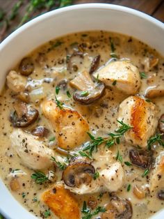 a white bowl filled with chicken and mushroom soup