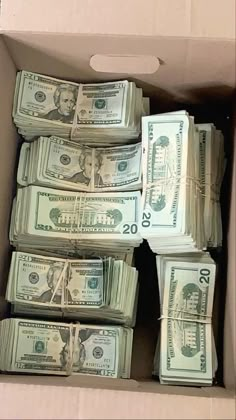 a box filled with lots of money sitting on top of a table