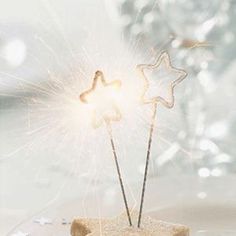 a cake with sparklers in the shape of stars