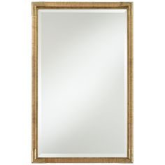 a gold framed mirror on a white wall