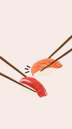 two sushi with chopsticks sticking out of them