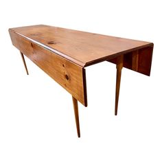 a wooden desk with two drawers on one side and an extension drawer on the other