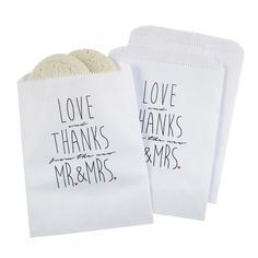 two white bags with the words love, thanks and mr & mrs printed on them